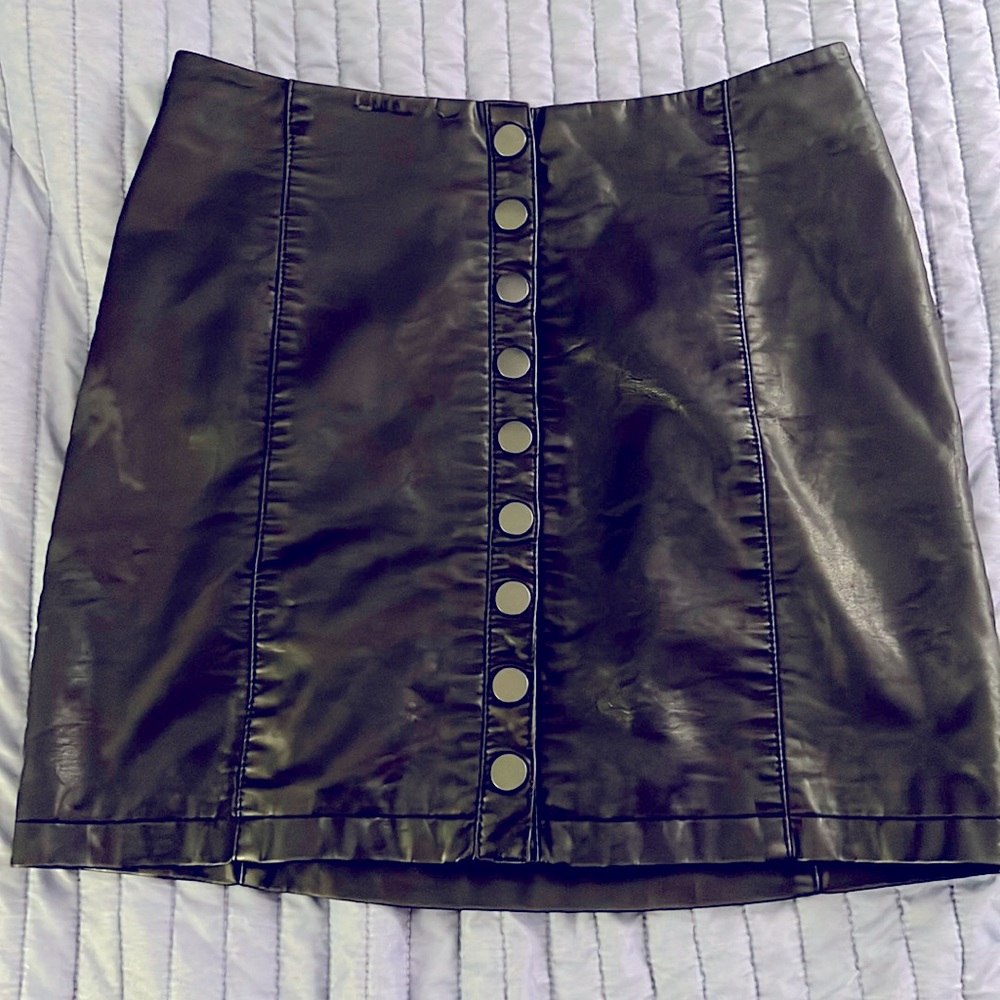 Vegan pleather size 6 free people mini skirt with snaps.